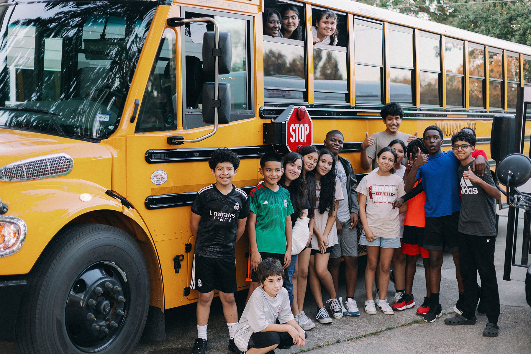 Kids on new bus Chinquapin Students in the Gym