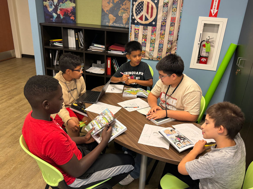 boys-at-table Chinquapin Students in the Gym